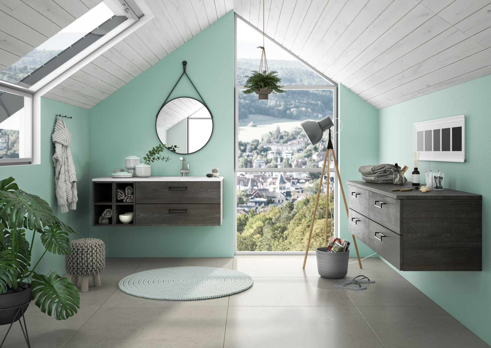 Mint blauwe badkamer met grijze badmeubels. Een ronde hangende spiegel. In een badmeubel zit ook een fijne opslag voor handdoeken en dergelijke.